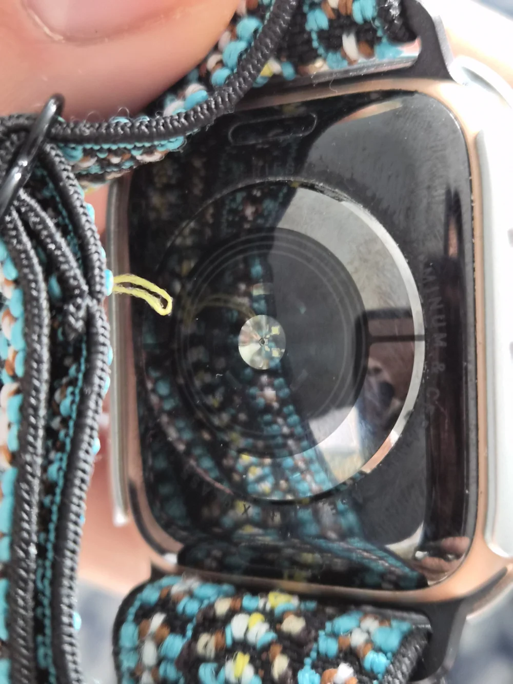 Apple Smartwatch with Black Case and Teal Patterned Woven Band